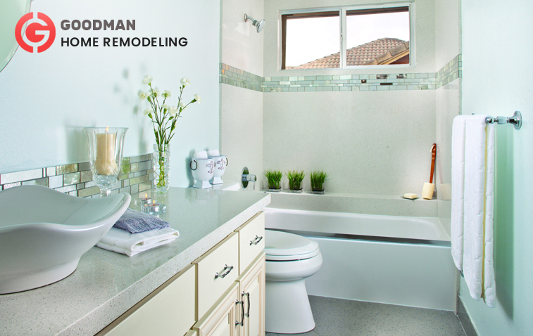 Compact bathroom with vanity cabinets, built-in bathtub, and towel rack for better storage.