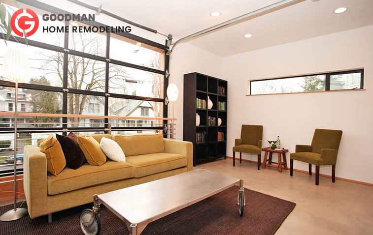 Converted garage into a modern living room with comfortable furniture and natural light.
